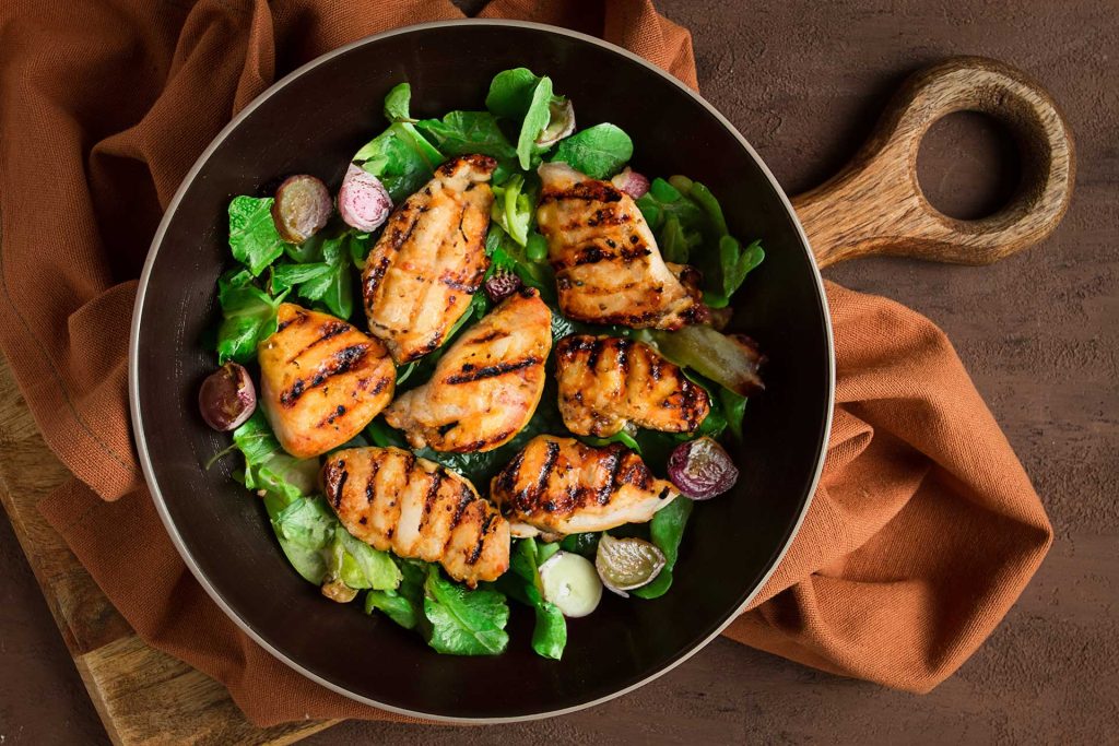 Fresh salad with grilled chicken chunks, a perfect pairing for Moroccan Mint Tea.